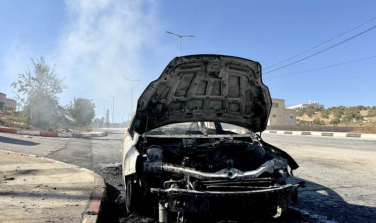 Israeli occupiers attack Palestinian man, burn vehicles Israeli occupiers attack Palestinian man, burn vehicles